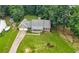 Aerial view of the home with a large, well-maintained lawn and a two-car garage at 2868 Wood Park Nw Trce, Kennesaw, GA 30152
