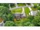 An aerial view of a home with a large lawn, mature trees, and a patio area for outdoor enjoyment at 2868 Wood Park Nw Trce, Kennesaw, GA 30152