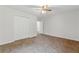 Comfortable bedroom with large closet and plush neutral colored carpeting at 2868 Wood Park Nw Trce, Kennesaw, GA 30152