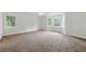 Spacious carpeted bedroom has bright natural light from the multiple windows at 2868 Wood Park Nw Trce, Kennesaw, GA 30152