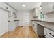 Bright kitchen features modern cabinetry, granite countertops, and hardwood floors at 2868 Wood Park Nw Trce, Kennesaw, GA 30152