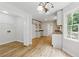 Bright kitchen features white cabinetry, modern lighting and stainless steel appliances at 2868 Wood Park Nw Trce, Kennesaw, GA 30152