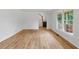 Living room with wood laminate flooring, staircase, and natural lighting at 2868 Wood Park Nw Trce, Kennesaw, GA 30152