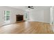 Inviting living room with hardwood floors, fireplace, and natural light from windows at 2868 Wood Park Nw Trce, Kennesaw, GA 30152