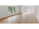 Spacious living room with wood laminate flooring, crown molding, and natural lighting at 2868 Wood Park Nw Trce, Kennesaw, GA 30152