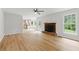 Open-concept living room flows into the kitchen featuring hardwood floors and ample light at 2868 Wood Park Nw Trce, Kennesaw, GA 30152