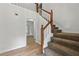 Carpeted staircase leads to the upper level of the home at 2868 Wood Park Nw Trce, Kennesaw, GA 30152