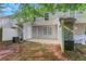 Spacious backyard with concrete patio, air conditioning units, and gray vinyl siding at 3516 Waldrop Trl, Decatur, GA 30034
