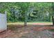 Green backyard featuring lush trees and space for outdoor activities and relaxation at 3516 Waldrop Trl, Decatur, GA 30034