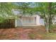 Inviting backyard with a door to the house and natural surroundings at 3516 Waldrop Trl, Decatur, GA 30034