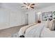 Large, carpeted primary bedroom featuring a view to the ensuite bathroom at 3516 Waldrop Trl, Decatur, GA 30034