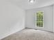 This bedroom has a window looking out to the backyard at 3516 Waldrop Trl, Decatur, GA 30034