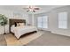 Bright bedroom with a plush bed, soft rug, and lots of natural light from the windows at 3516 Waldrop Trl, Decatur, GA 30034