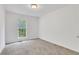 This bedroom features neutral carpets and white walls at 3516 Waldrop Trl, Decatur, GA 30034