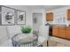 Bright dining area showcasing a glass table, white chairs, and modern decor at 3516 Waldrop Trl, Decatur, GA 30034