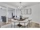 Elegant dining area featuring modern furnishings and open access to the living room at 3516 Waldrop Trl, Decatur, GA 30034