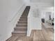 Inviting entryway with modern flooring and staircase leading to the upper level at 3516 Waldrop Trl, Decatur, GA 30034