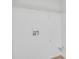 Bright laundry room with white walls, connections, and a wire shelf for storage at 3516 Waldrop Trl, Decatur, GA 30034