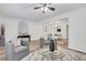 Spacious living area with a glass coffee table, plush chairs, and an open layout at 3516 Waldrop Trl, Decatur, GA 30034