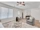 Well-lit living area with a shag rug, stylish chairs, and a glass coffee table at 3516 Waldrop Trl, Decatur, GA 30034