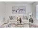 Comfortable living space with elegant furnishings, artwork, and a round glass table at 3516 Waldrop Trl, Decatur, GA 30034