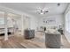 Open-concept living room with a view of the dining area and modern finishes at 3516 Waldrop Trl, Decatur, GA 30034