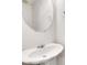 Clean powder room featuring a pedestal sink and a simple, elegant mirror at 3516 Waldrop Trl, Decatur, GA 30034