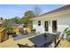 Outdoor deck featuring ample seating, a dining area, and views of the surroundings at 102 Rockyford, Atlanta, GA 30317