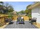 Relaxing deck featuring modern outdoor furniture and a view of the serene backyard at 102 Rockyford, Atlanta, GA 30317