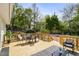 Spacious wooden deck with outdoor seating and a lush backyard view at 102 Rockyford, Atlanta, GA 30317