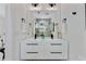 Modern bathroom featuring a double vanity, sleek fixtures, and a large mirror at 102 Rockyford, Atlanta, GA 30317