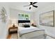 Cozy bedroom featuring a comfortable bed, decorative lighting, and stylish artwork at 102 Rockyford, Atlanta, GA 30317
