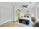 Bright bedroom with white walls, a sliding barn door, and a comfortable bed with stylish decor at 102 Rockyford, Atlanta, GA 30317