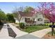 Charming home featuring a landscaped yard, inviting porch, and updated driveway at 102 Rockyford, Atlanta, GA 30317