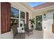 Inviting front porch with cozy seating, a green front door, and decorative shutters at 102 Rockyford, Atlanta, GA 30317