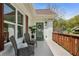 Inviting front porch with cozy seating and a view of the landscaped yard at 102 Rockyford, Atlanta, GA 30317