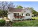 Charming home with a manicured front yard, cozy porch, and pristine landscaping at 102 Rockyford, Atlanta, GA 30317