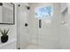 Contemporary shower with glass door, white tile, and sleek fixtures at 102 Rockyford, Atlanta, GA 30317
