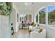 Inviting sunroom with a desk, two comfy armchairs, and windows offering picturesque outdoor views at 102 Rockyford, Atlanta, GA 30317
