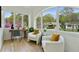 Cozy sunroom featuring bright, natural light, hardwood flooring, and comfortable seating at 102 Rockyford, Atlanta, GA 30317