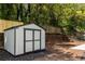 Functional backyard storage shed surrounded by lush landscaping at 126 Marona Ne St, Atlanta, GA 30307