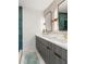 Modern bathroom featuring a double vanity and striking teal tiled shower at 126 Marona Ne St, Atlanta, GA 30307