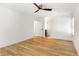Bright bedroom featuring hardwood floors, white walls, and modern ceiling fan at 126 Marona Ne St, Atlanta, GA 30307