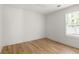 Bright bedroom with hardwood floors, a window view, and neutral decor at 126 Marona Ne St, Atlanta, GA 30307