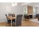 Bright dining room with modern lighting, decorative fireplace, and hardwood floors at 126 Marona Ne St, Atlanta, GA 30307