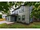 Charming two-story home with a modern design, dark trim, large windows, and manicured lawn at 126 Marona Ne St, Atlanta, GA 30307