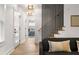 Bright hallway with white walls, doors, hardwood floors, leading to stairs and bedroom at 126 Marona Ne St, Atlanta, GA 30307