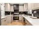 Modern kitchen featuring stainless steel appliances, sleek countertops, and stylish backsplash at 126 Marona Ne St, Atlanta, GA 30307