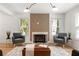 Inviting living room with a fireplace feature, natural light, and stylish decor at 126 Marona Ne St, Atlanta, GA 30307