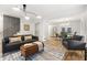Bright living room featuring modern lighting, hardwood floors and a comfortable sofa and decor at 126 Marona Ne St, Atlanta, GA 30307